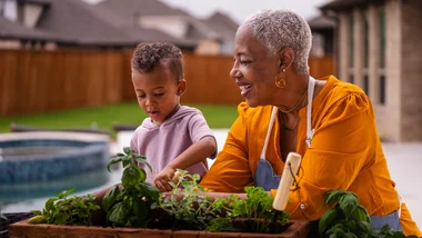 Grandmother and grandson gardening